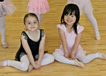 Two young girls in dance leotard