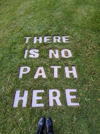 Concrete letters laid on grass