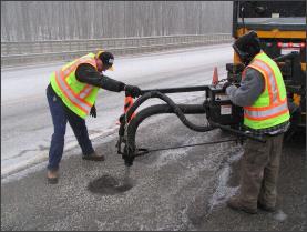 DPW Workers fixing a pothole