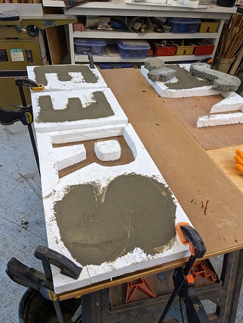 Molds of letters in concrete